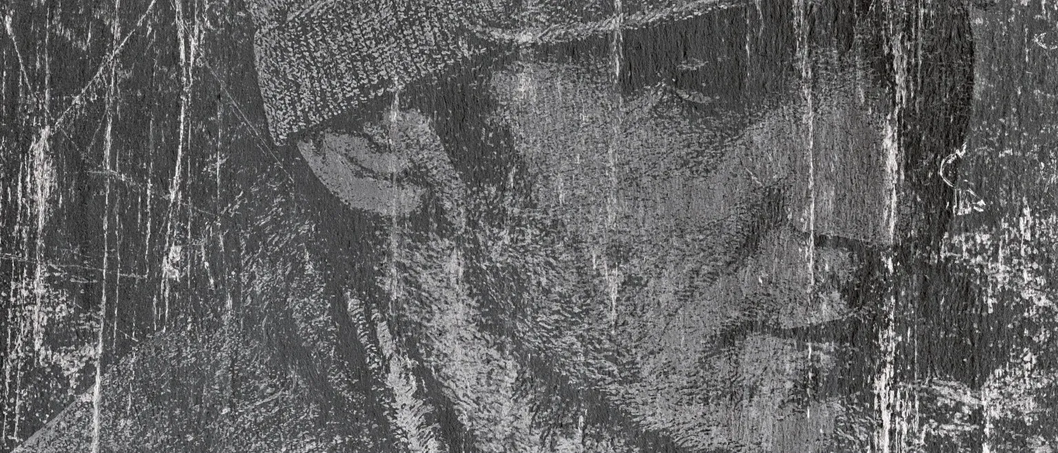 A face under a knitted beanie, surfacing through heavy scratches on a near-black ground.