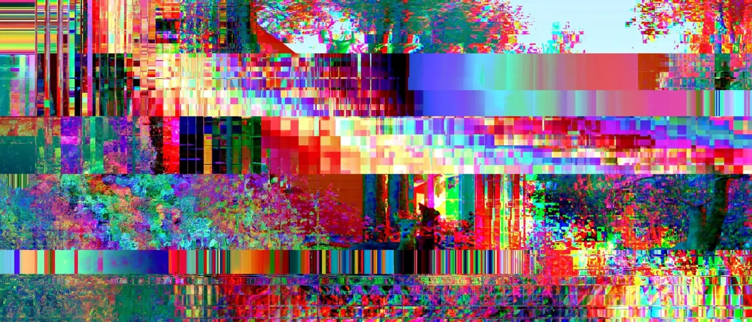 A tree and street torn into RGB-shifted blocks, a red-roofed building glitching through vertical colour bands.