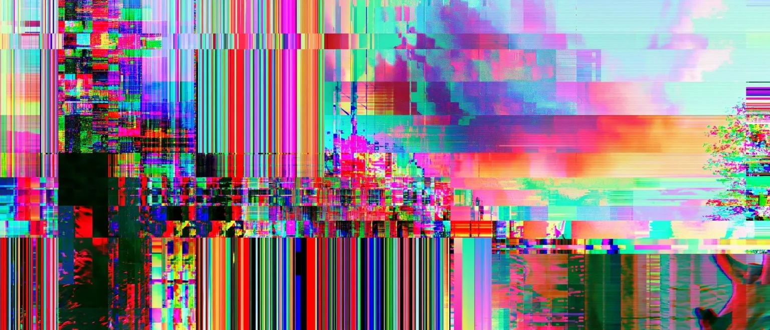 Dense multicoloured pixel blocks over a landscape, a warm gradient band of orange and rose crossing the centre.