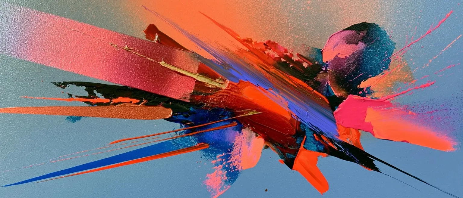 A blue and orange burst breaking apart against a pale blue sky.