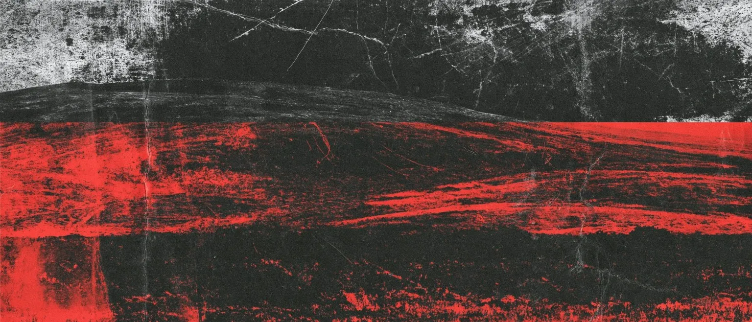 Red streaks running horizontally across a scored grey field.
