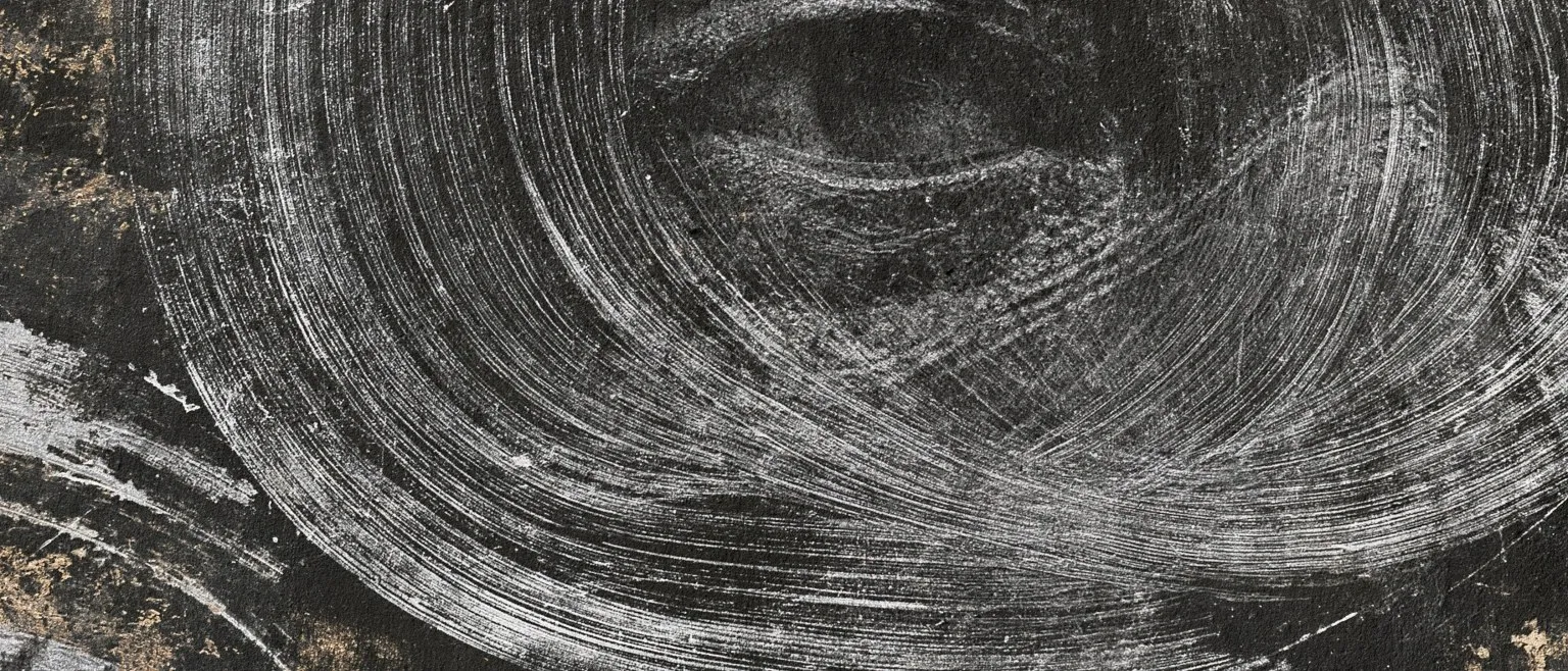 A great spiral of white combing over black, gold bleeding at the corners.