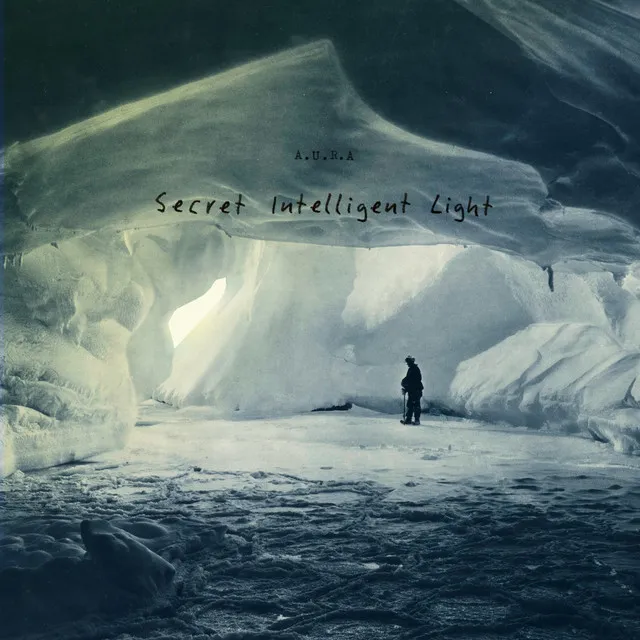 A figure standing alone at the mouth of an ice cave, the title written by hand across the ice.